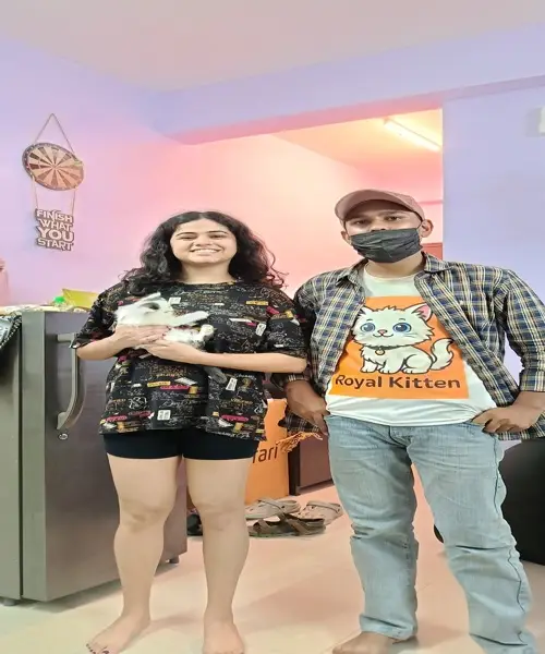 happy cat parents with their kitten from trusted Persian cat breeders